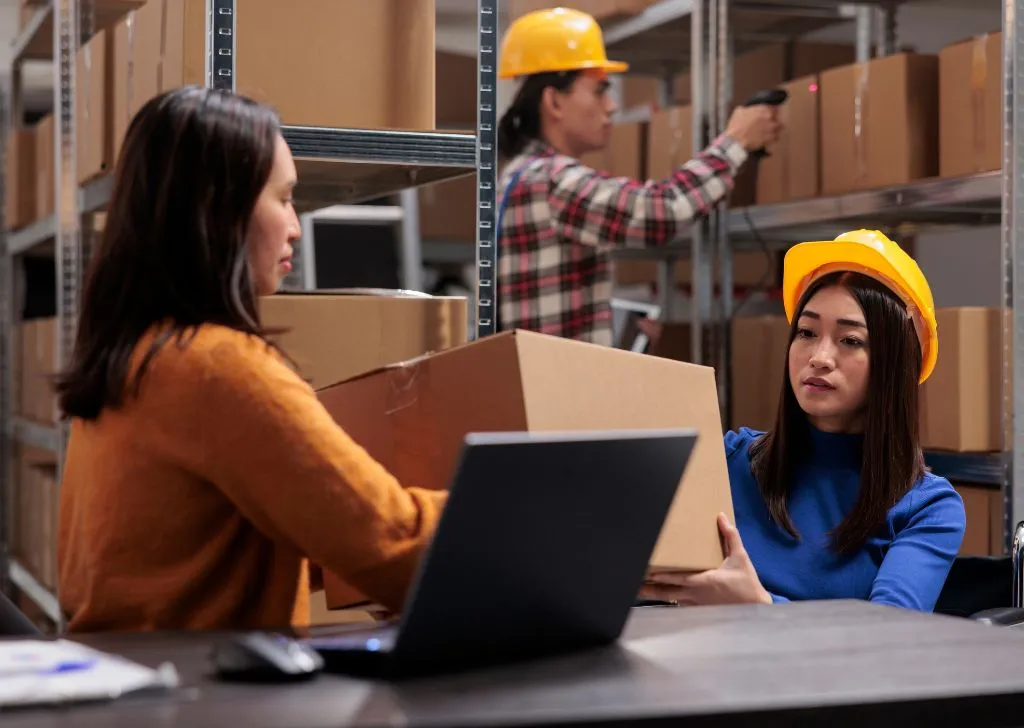 Warehouse staff workers running an inventory check.