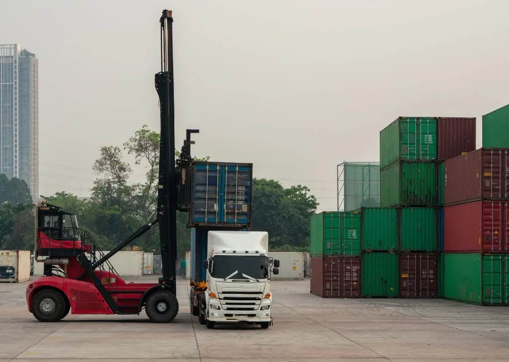 A pile of shipping containers stacked with goods brought in by a pharmaceutical importer in Malaysia ready to be distributed.