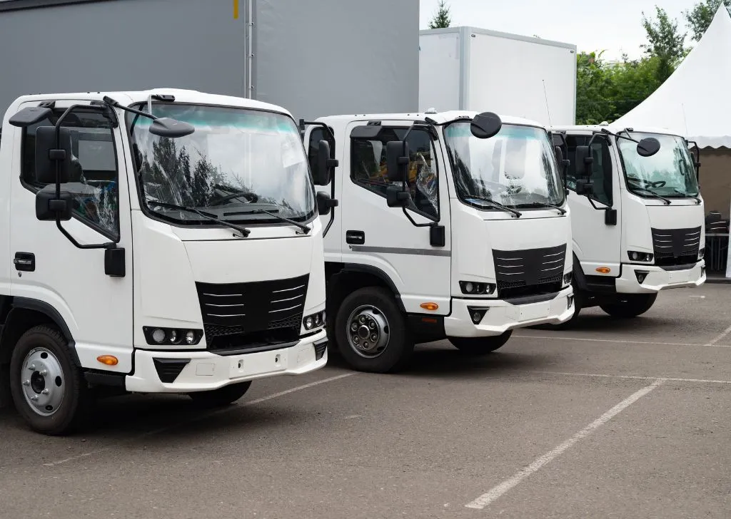 A fleet of shipping trucks equipped for cold chain logistics in Malaysia.
