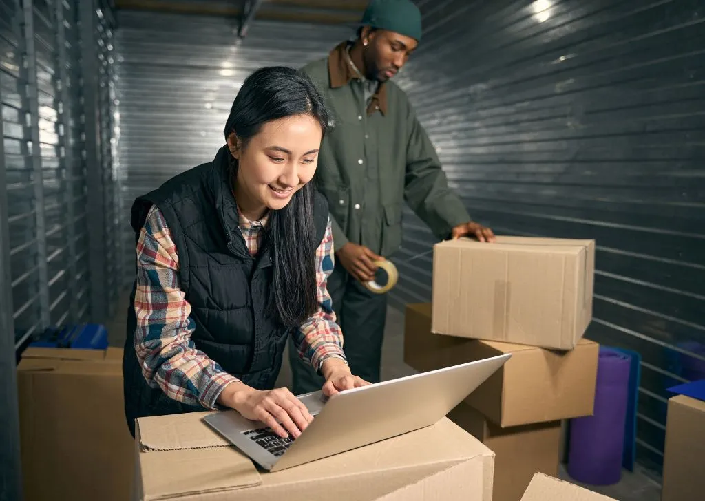 A cold chain logistics staff in Malaysia updating the shipping manifest.