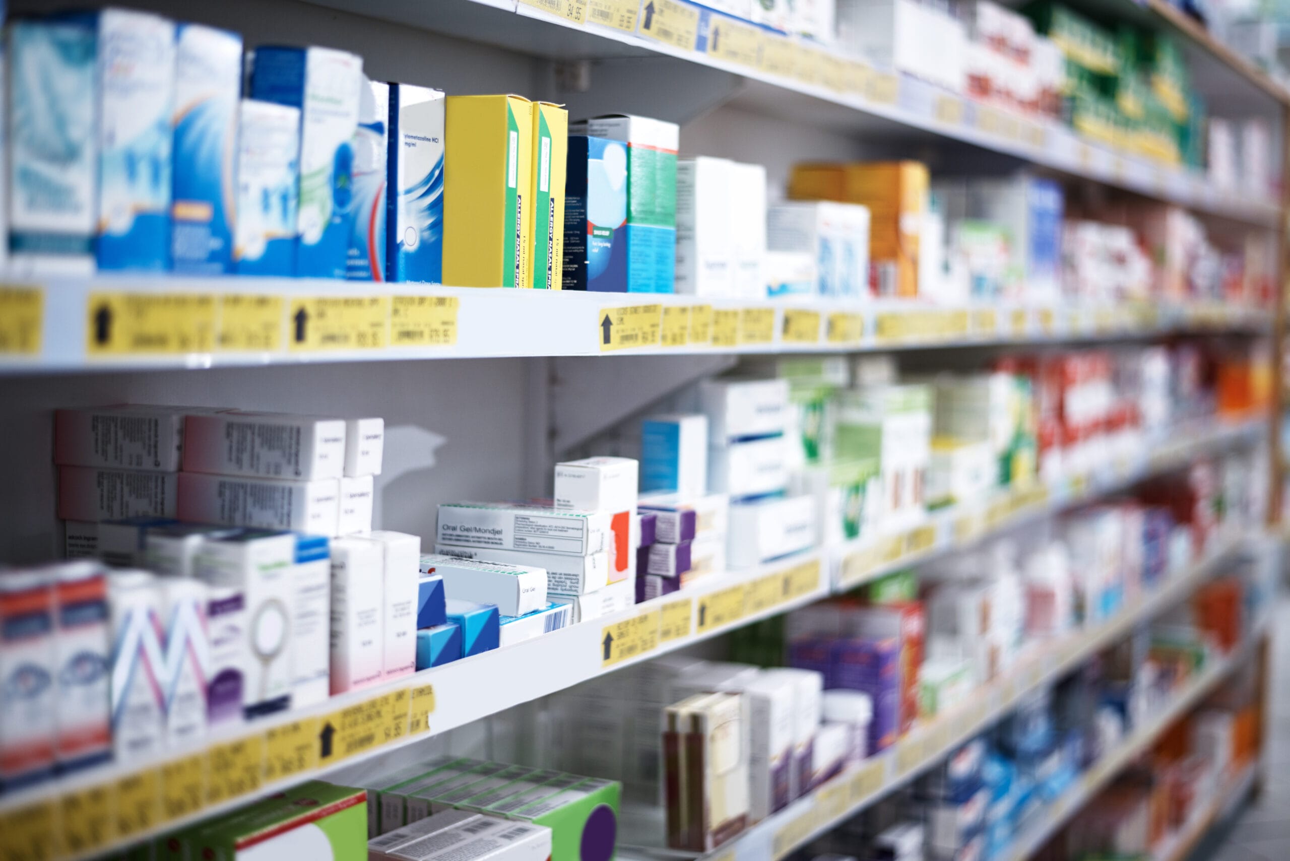 OTC health products displayed on a pharmacy shelf in Malaysia
